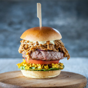 Gourmet burger with pulled pork and piccalilli
